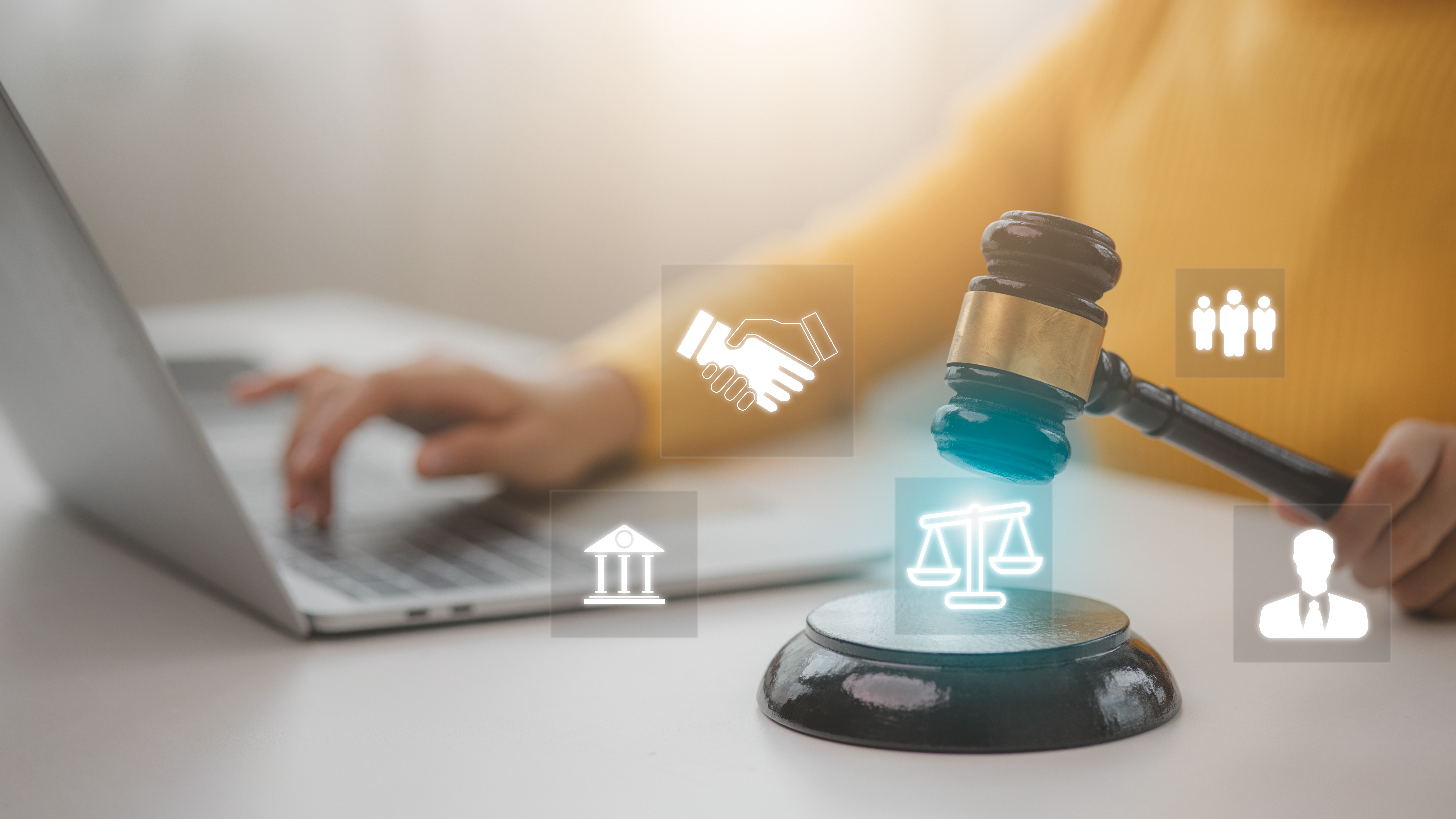 Professional with laptop, gavel, and collaboration icons